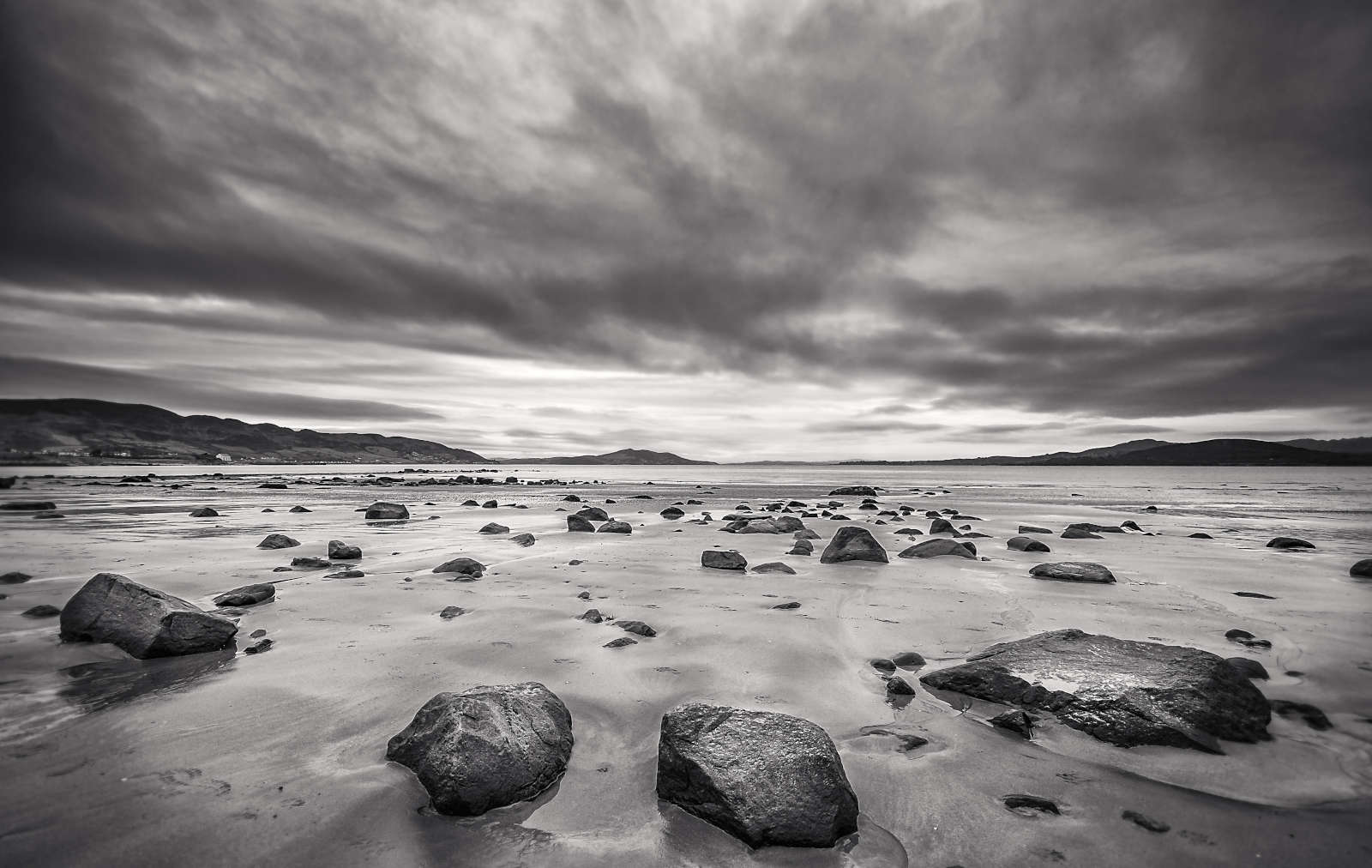 Photo of a sunset at the pier at Dunree Beach, County Donegal